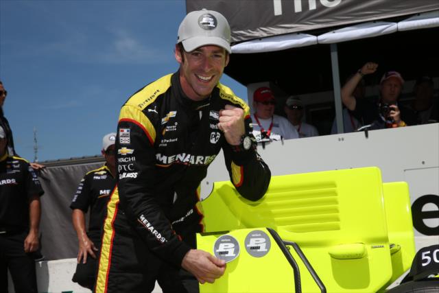 Simon Pagenaud affixes the Verizon P1 Award emblem to his No. 22 Menards Chevrolet after winning the pole for the Iowa Corn 300 at Iowa Speedway -- Photo by: Chris Jones