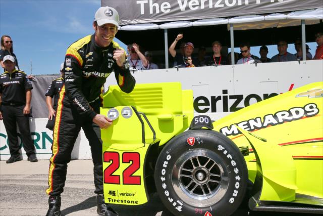 Simon Pagenaud affixes the Verizon P1 Award emblem to his No. 22 Menards Chevrolet after winning the pole position for the Iowa Corn 300 at Iowa Speedway -- Photo by: Chris Jones