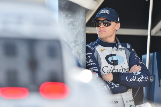 Max Chilton watches qualifications from his pit stand at Iowa Speedway -- Photo by: Chris Owens