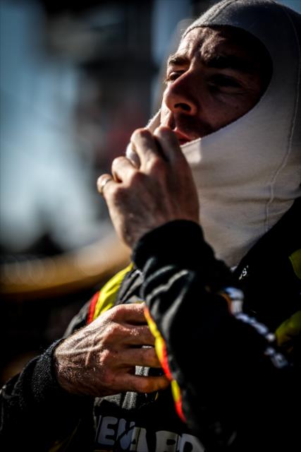 Simon Pagenaud adjusts his balaclava along pit lane prior to the final practice for the Iowa Corn 300 at Iowa Speedway -- Photo by: Shawn Gritzmacher