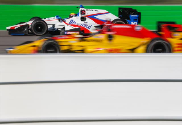 Gabby Chaves passes Ryan Hunter-Reay down the backstretch during the final practice for the Iowa Corn 300 at Iowa Speedway -- Photo by: Shawn Gritzmacher