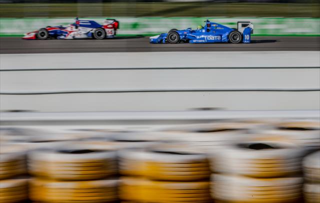 Takuma Sato and Tony Kanaan go nose-to-tail down the backstretch during the evening practice for the Iowa Corn 300 at Iowa Speedway -- Photo by: Shawn Gritzmacher