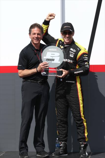 Simon Pagenaud accepts the Verizon P1 Award for winning the pole position for the Iowa Corn 300 at Iowa Speedway -- Photo by: Chris Jones