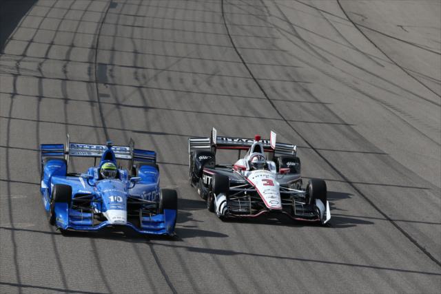 Tony Kanaan and Helio Castroneves go wheel-to-wheel down the frontstretch during the Iowa Corn 300 at Iowa Speedway -- Photo by: Chris Jones