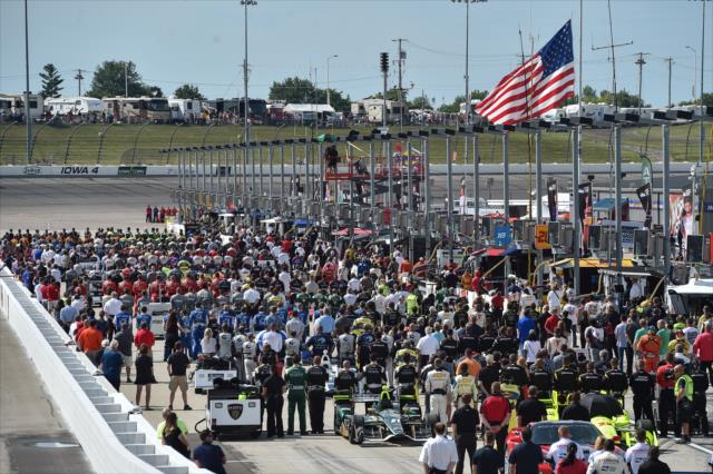 Teams and their machines along pit lane during pre-race festivities for the Iowa Corn 300 at Iowa Speedway -- Photo by: Chris Owens