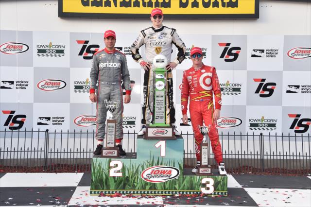 The podium of Josef Newgarden, Will Power, and Scott Dixon with their trophies in Victory Lane following the Iowa Corn 300 at Iowa Speedway -- Photo by: Chris Owens