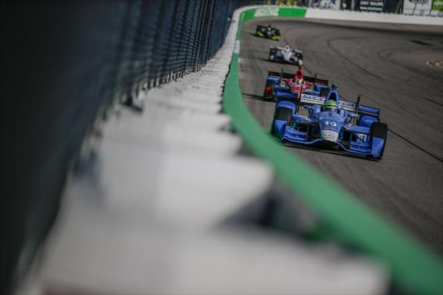 Tony Kanaan leads a group into Turn 3 during the Iowa Corn 300 at Iowa Speedway -- Photo by: Shawn Gritzmacher
