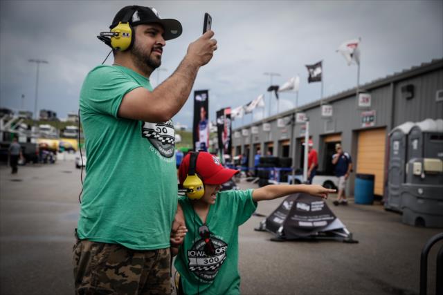Fans capture the garage activity at Iowa Speedway prior to the Iowa Corn 300 -- Photo by: Shawn Gritzmacher