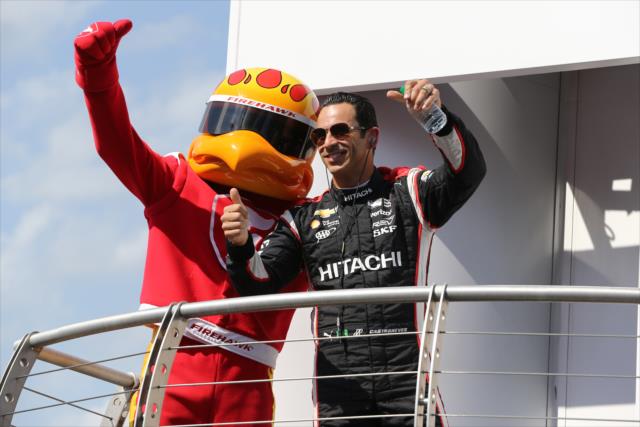 Helio Castroneves poses with the Firestone Firehawk during pre-race introductions for the Iowa Corn 300 at Iowa Speedway -- Photo by: Chris Jones
