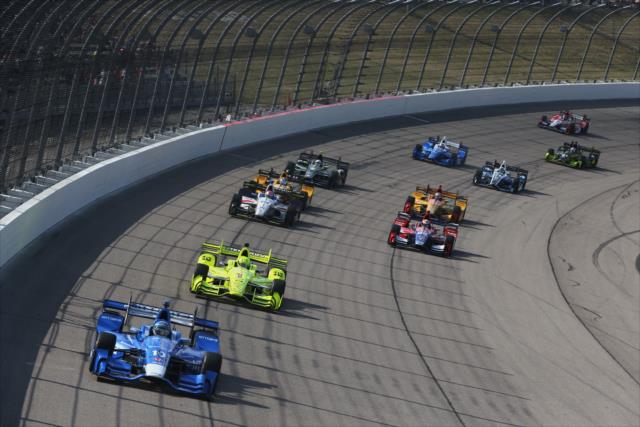 Tony Kanaan leads a group out of Turn 4 during the Iowa Corn 300 at Iowa Speedway -- Photo by: Chris Jones