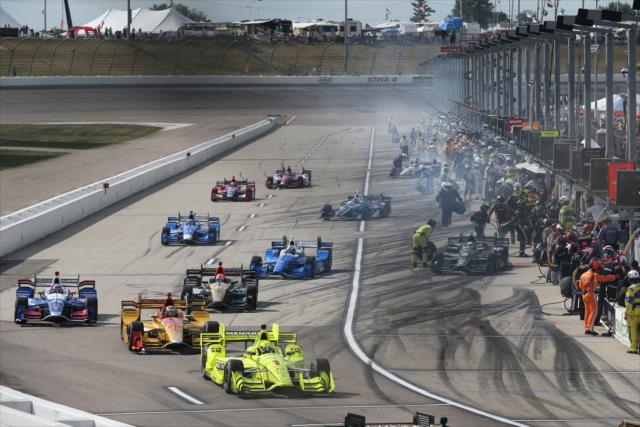 Simon Pagenaud leads a group out of pit lane during an early caution during the Iowa Corn 300 at Iowa Speedway -- Photo by: Chris Jones
