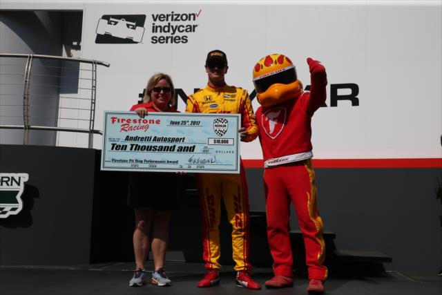 Ryan Hunter-Reay accepts the Firestone Pit Stop Performance Award on behalf of Andretti Autosport for their performance in Road America -- Photo by: Chris Jones