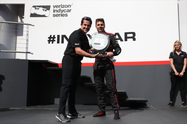 Will Power accepts the Verizon P1 Award for winning the pole position during pre-race festivities for the Iowa Corn 300 at Iowa Speedway -- Photo by: Chris Jones