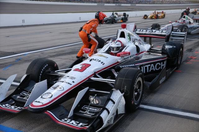 Helio Castroneves peels out of his pit stall after service during the Iowa Corn Indy 300 -- Photo by: Chris Jones