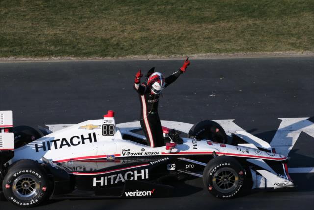 Helio Castroneves gets out of his car to begin the celebration with the fans after winning the Iowa Corn 300 at Iowa Speedway -- Photo by: Chris Jones