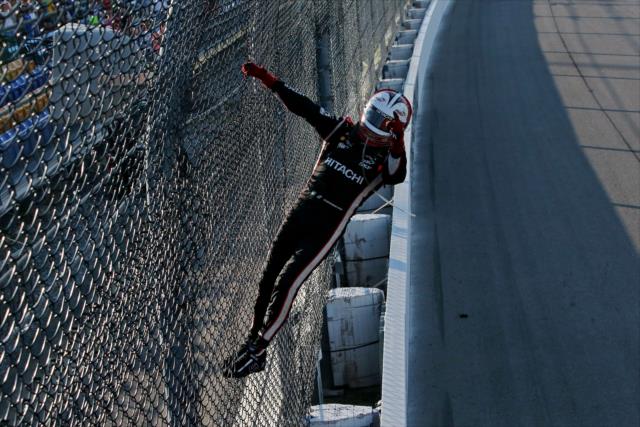 Helio Castroneves celebrates with a fence climb after winning the Iowa Corn 300 at Iowa Speedway -- Photo by: Chris Jones