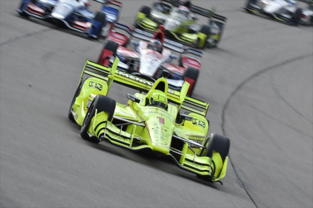 Simon Pagenaud leads a group into Turn 1 during the Iowa Corn 300 at Iowa Speedway -- Photo by: Chris Owens