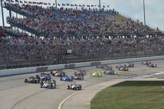 The field screams into Turn 1 to start the Iowa Corn 300 at Iowa Speedway -- Photo by: Chris Owens