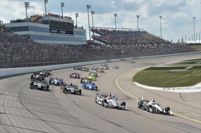 Helio Castroneves and Will Power lead the field into Turn 1 during the Iowa Corn 300 at Iowa Speedway -- Photo by: Chris Owens