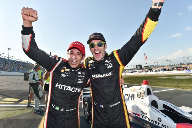 Helio Castroneves celebrates his victory with Simon Pagenaud on the frontstretch following the Iowa Corn 300 at Iowa Speedway -- Photo by: Chris Owens