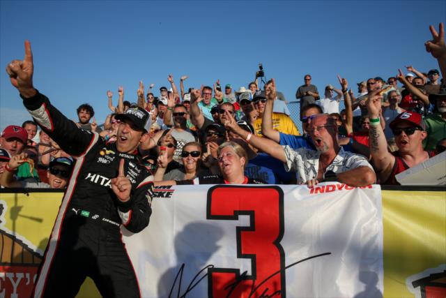 Helio Castroneves celebrates with the fans in Victory Circle following his win in the Iowa Corn 300 at Iowa Speedway -- Photo by: Joe Skibinski