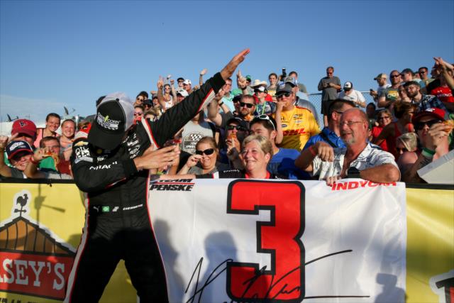 Helio Castroneves with a dab to the crowd in Victory Circle following his win in the Iowa Corn 300 at Iowa Speedway -- Photo by: Joe Skibinski