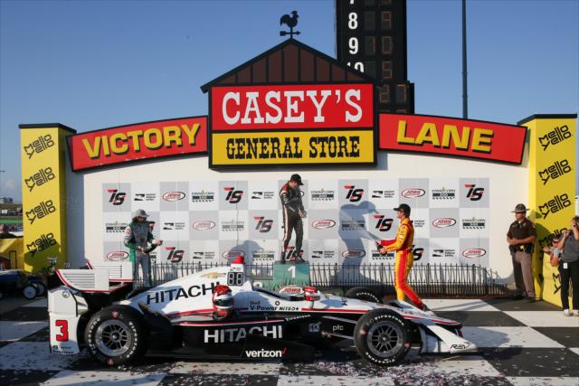 The podium of Helio Castroneves, JR Hildebrand, and Ryan Hunter-Reay spray the champagne in Victory Circle following the Iowa Corn 300 -- Photo by: Joe Skibinski