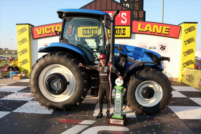 Helio Castroneves with the Iowa Corn tractor in Victory Circle after winning the 2017 Iowa Corn 300 at Iowa Speedway -- Photo by: Joe Skibinski