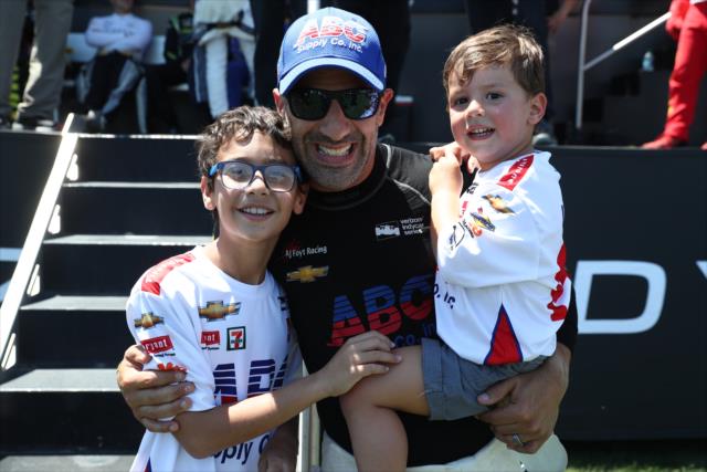 Tony Kanaan with two of his sons backstage during pre-race festivities for the Iowa Corn 300 at Iowa Speedway -- Photo by: Chris Jones