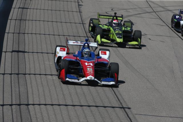 Tony Kanaan and Charlie Kimball race down the frontstretch during the Iowa Corn 300 at Iowa Speedway -- Photo by: Chris Jones