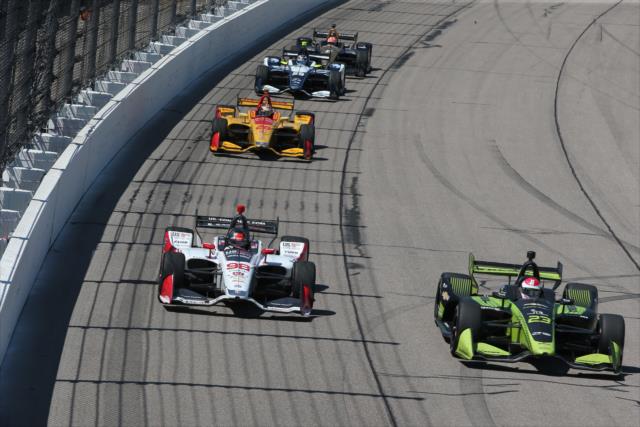 Charlie Kimball and Marco Andretti lead a train of cars down the frontstretch during the Iowa Corn 300 at Iowa Speedway -- Photo by: Chris Jones