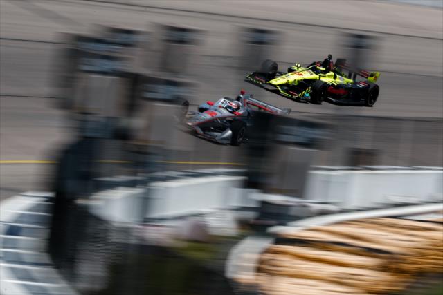 Will Power and Sebastien Bourdais dive into Turn 4 during the Iowa Corn 300 at Iowa Speedway -- Photo by: Joe Skibinski