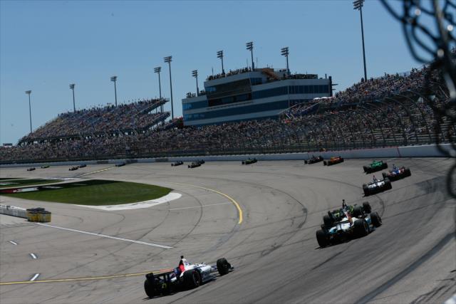 The field streams out of Turn 4 down the fronstretch during the Iowa Corn 300 at Iowa Speedway -- Photo by: Joe Skibinski