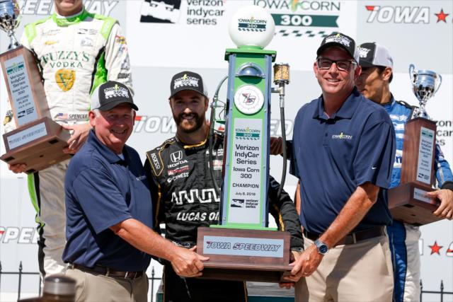 James Hinchcliffe is awarded his 1st Place trophy in Victory Circle after winning the Iowa Corn 300 at Iowa Speedway -- Photo by: Joe Skibinski