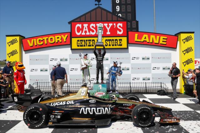 James Hinchcliffe hoists his winners trophy in Victory Circle after winning the 2018 Iowa Corn 300 at Iowa Speedway -- Photo by: Joe Skibinski