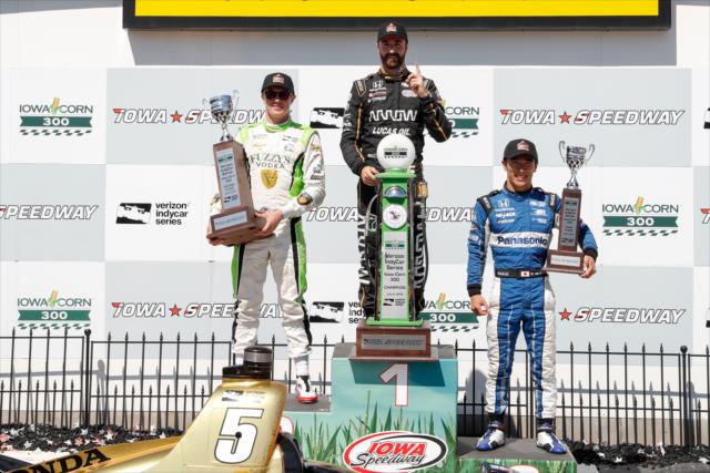 The podium of James Hinchcliffe, Spencer Pigot, and Takuma Sato with their trophies in Victory Lane following the Iowa Corn 300 at Iowa Speedway -- Photo by: Joe Skibinski