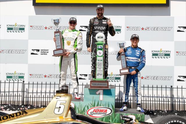 The podium of James Hinchcliffe, Spencer Pigot, and Takuma Sato with their trophies in Victory Lane following the Iowa Corn 300 at Iowa Speedway -- Photo by: Joe Skibinski