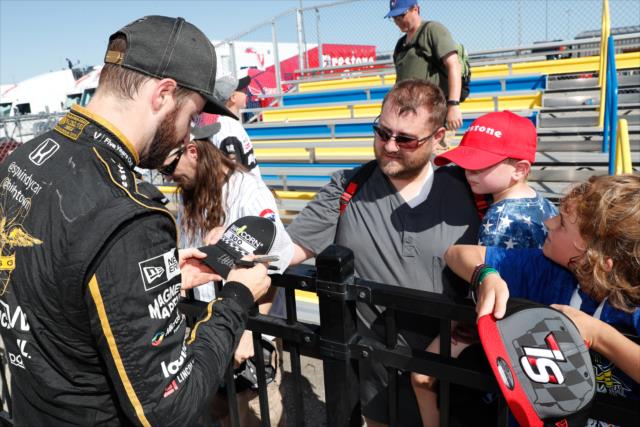 James Hinchcliffe signs an autograph in Victory Circle after winning the 2018 Iowa Corn 300 at Iowa Speedway -- Photo by: Joe Skibinski