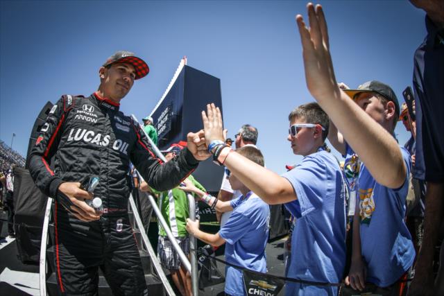 Robert Wickens greets young fans during pre-race introductions for the Iowa Corn 300 at Iowa Speedway -- Photo by: Shawn Gritzmacher