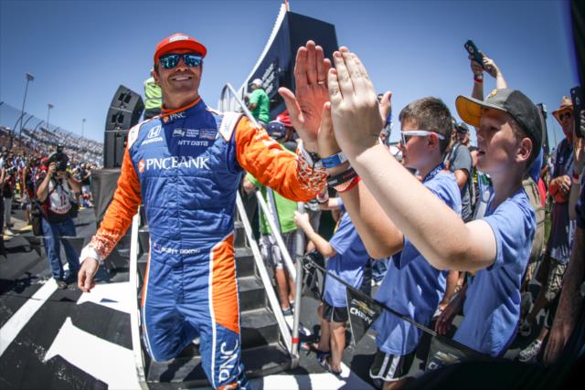 Scott Dixon greets some young fans during pre-race introductions for the Iowa Corn 300 at Iowa Speedway -- Photo by: Shawn Gritzmacher