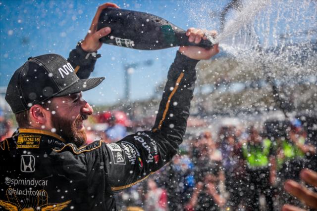 James Hinchcliffe sprays the champagne in Victory Circle after winning the Iowa Corn 300 at Iowa Speedway -- Photo by: Shawn Gritzmacher