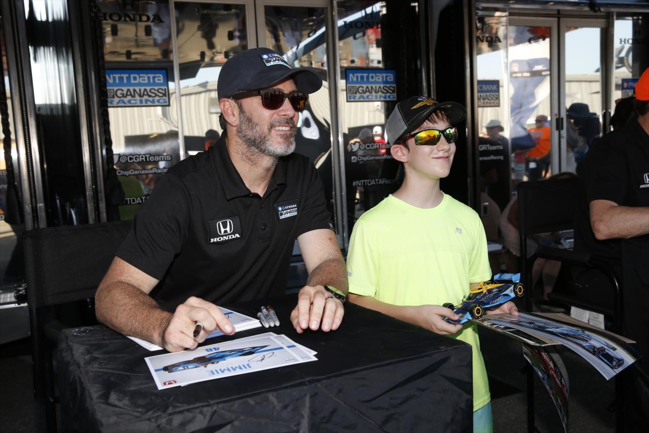 Jimmie Johnson with a fan - Hy-VeeDeals.com 250 presented by DoorDash - By: Chris Jones -- Photo by: Chris Jones