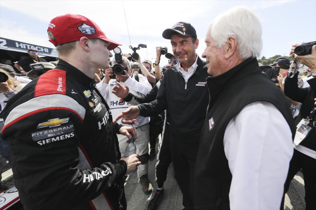 Josef Newgarden celebrates the 2019 NTT IndyCar Series Championship win with Roger Penske and Tim Cindric -- Photo by: Chris Owens