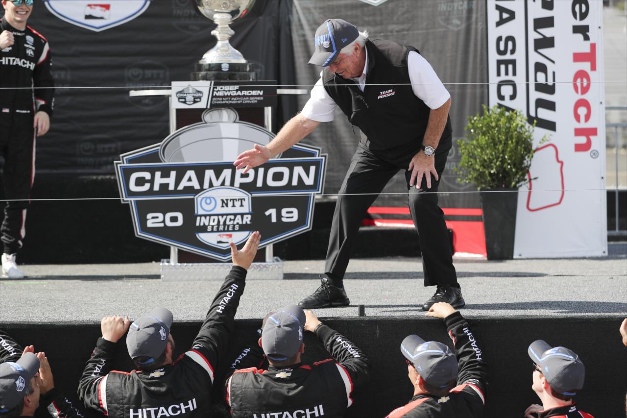 Roger Penske celebrates winning the 2019 NTT IndyCar Series Championship with members of the No. 2 team -- Photo by: Chris Owens