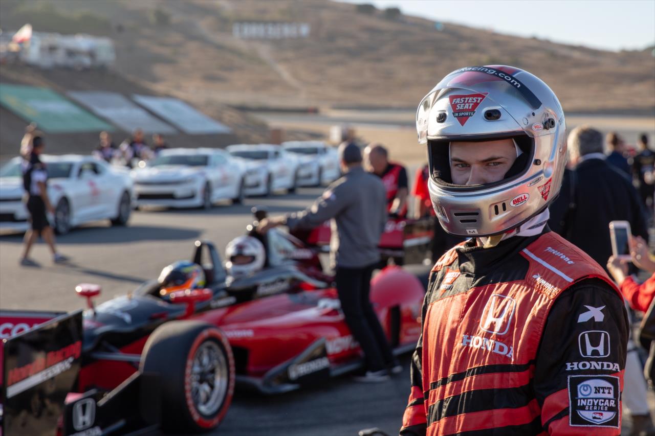 Actor Justin Prentice preparing to ride the Honda 2-seater -- Photo by: Stephen King