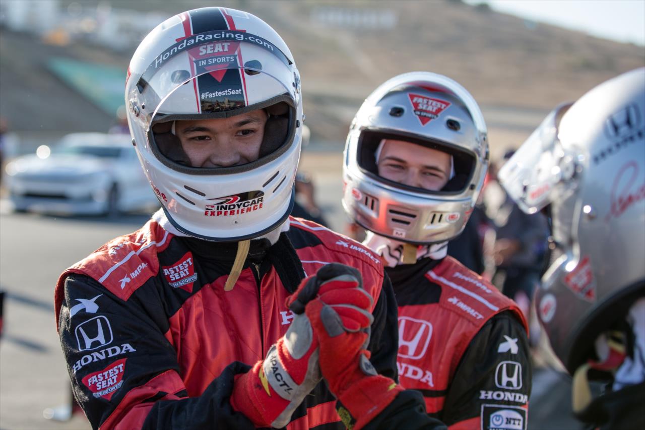 Actors Ross Butler and Justin Prentice preparing to ride the Honda 2-seater -- Photo by: Stephen King