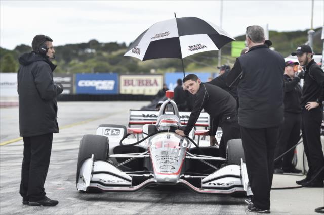 Will Power and Team Penske wait out the rain on pit lane during the team test at WeatherTech Raceway Laguna Seca -- Photo by: Chris Owens
