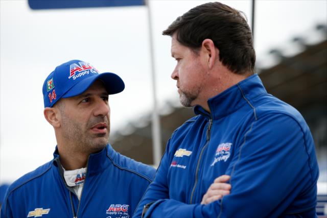 Tony Kanaan chats with his chief engineer, Eric Cowdin, on pit lane during the team test at WeatherTech Raceway Laguna Seca -- Photo by: Joe Skibinski