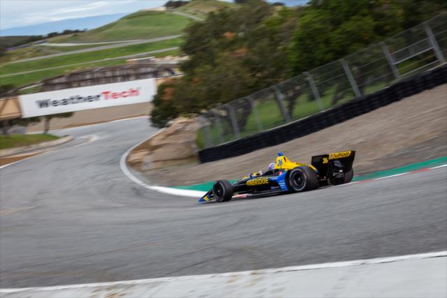 Zach Veach dives into the Corkscrew (Turns 8-8A) during the team test at WeatherTech Raceway Laguna Seca -- Photo by: Stephen King