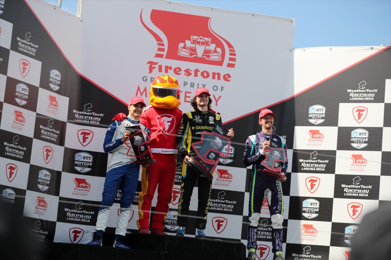 The podium with Alex Palou, Firehawk, Colton Herta and Romain Grosjean - Firestone Grand Prix of Monterey -- Photo by: Joe Skibinski
